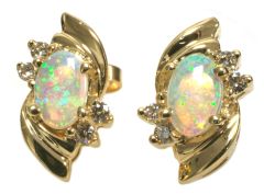 14K yellow gold stud earrings with opal and 4 diamond accents. 