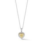 18 karat yellow and white gold with 1 heart shaped yellow diamond 0.60ct and with 17 round white diamonds 0.20ct total weight.